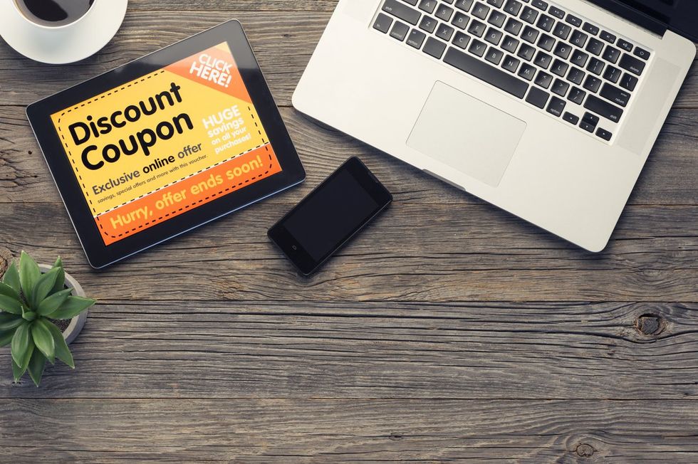 a tablet showing discount coupons