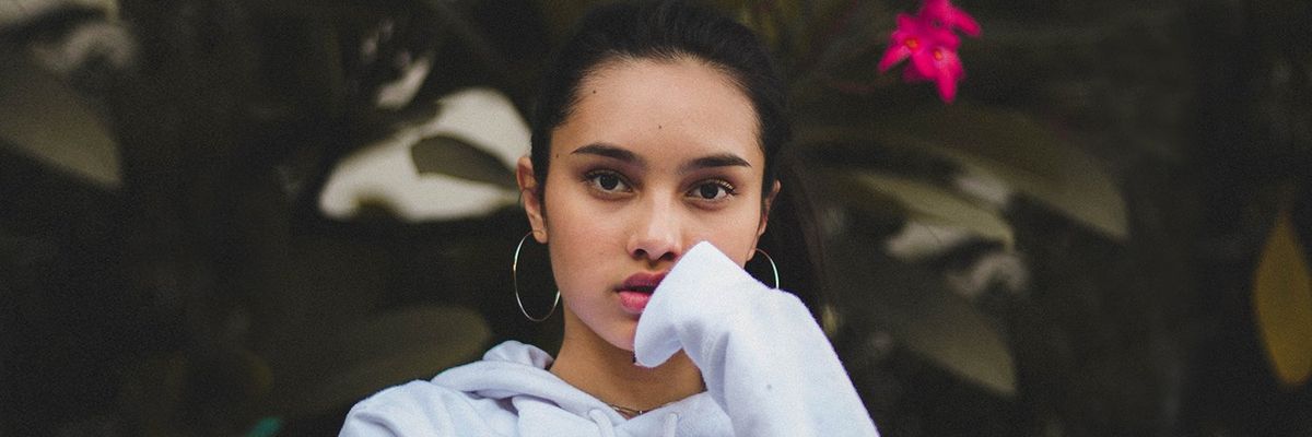 Latina woman wearing big hoop earrings