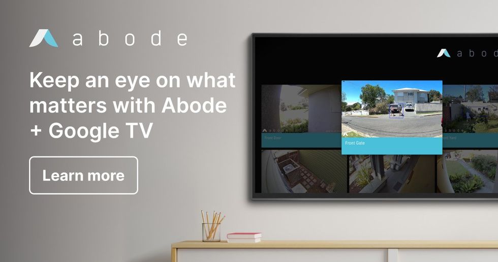 a photo of a television with Google TV streaming live video from an abode security camera.