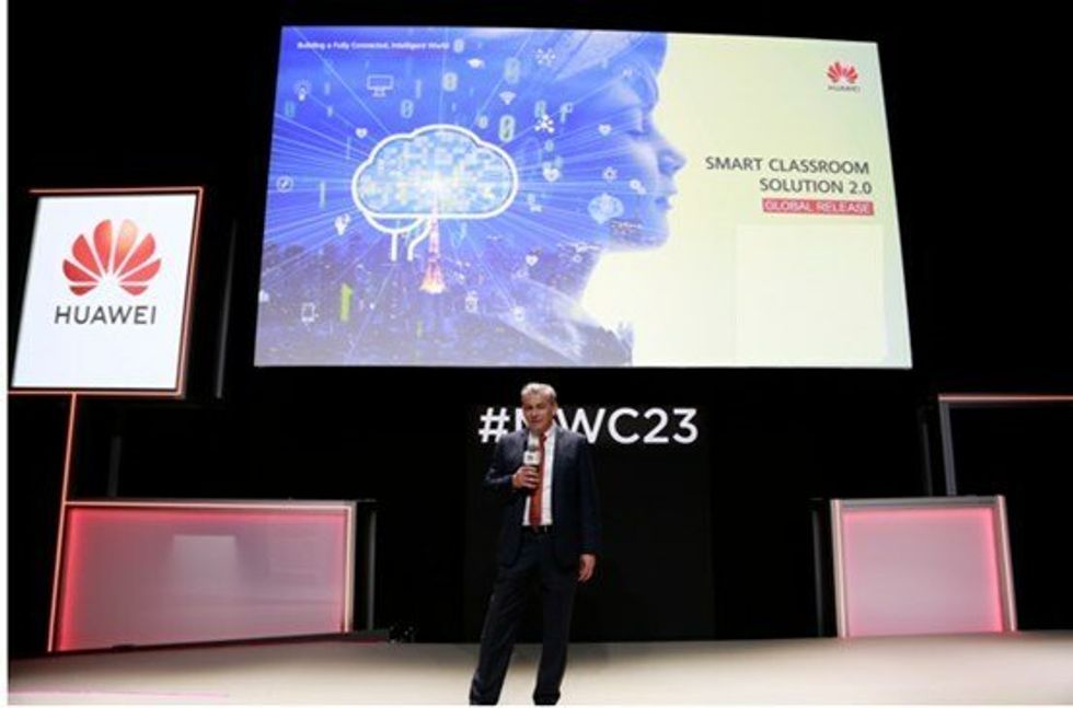 a photo of Huawei executive explaining Huawei Smart Classroom Solution 2.0 at MWC 2023