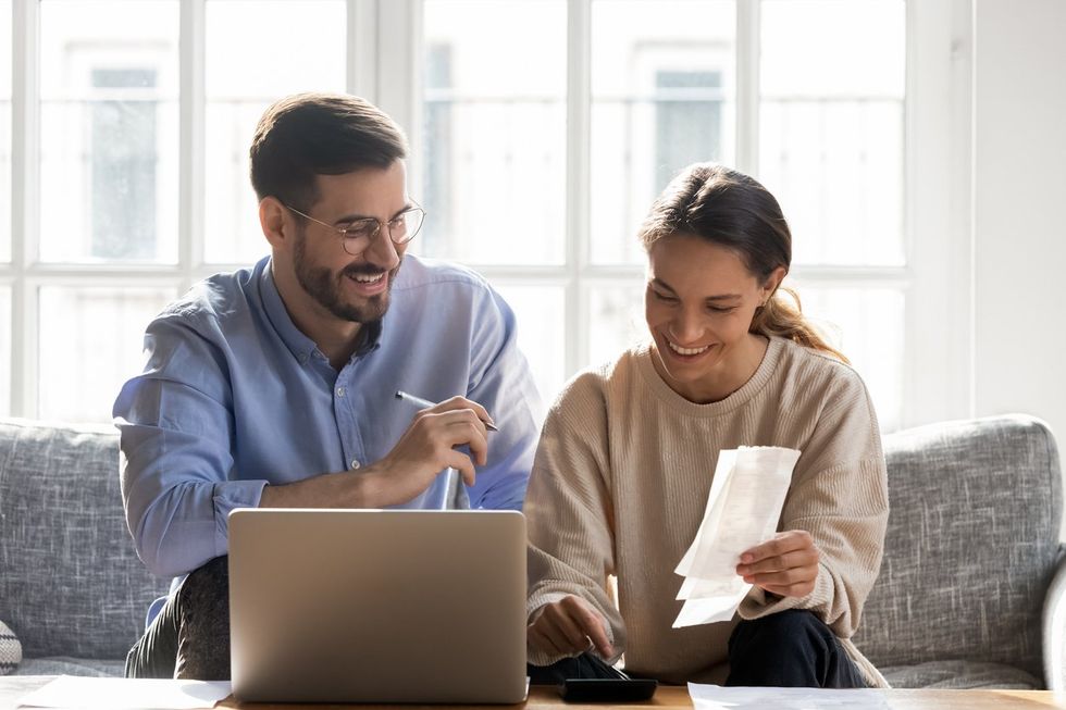 a photo of a woman and man discussing finances