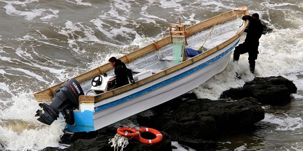 NextImg:At least 8 migrants drown after pair of suspected smuggling boats capsize; number of survivors unknown