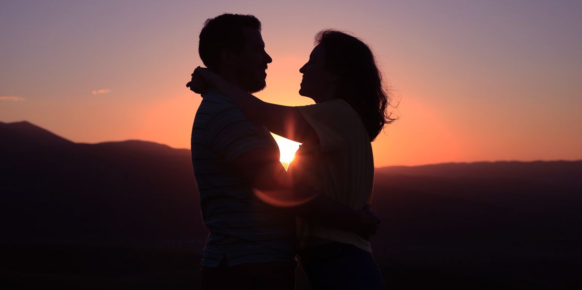 silhouette of hugging couple