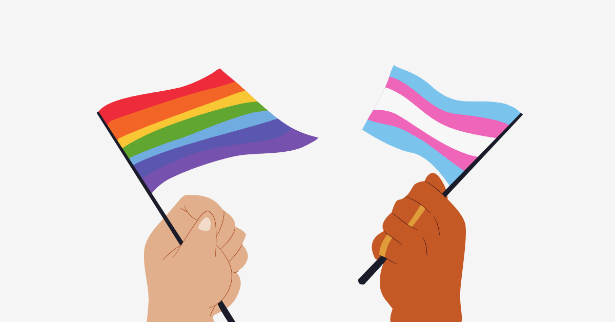 two hands holding an lgbtqia flag and a trans flag
