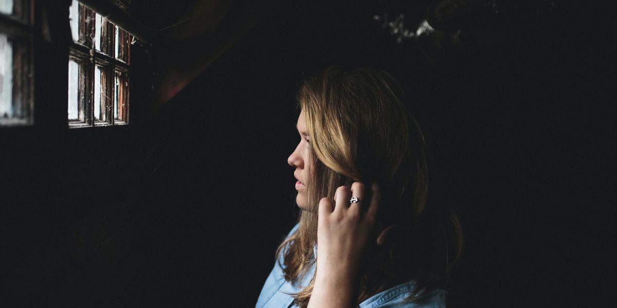 Woman scratching head