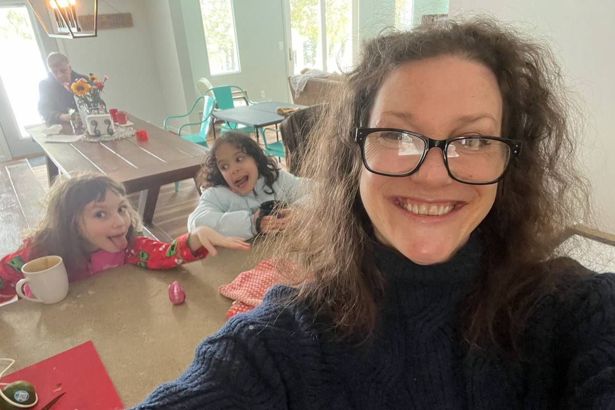 Donna Rose and Tallulah drinking cocoa and making faces behind me, looking very pretty and FIFTY!
