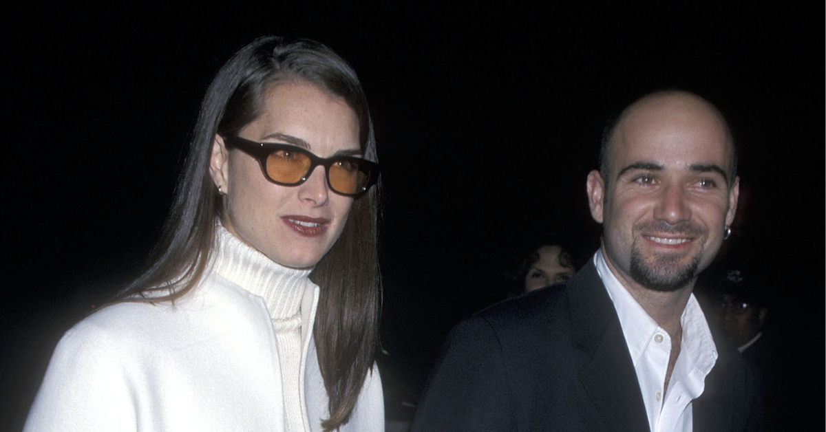A photo of Actress Brooke Shields and tennis star Andre Agassi taken outdoors at night.