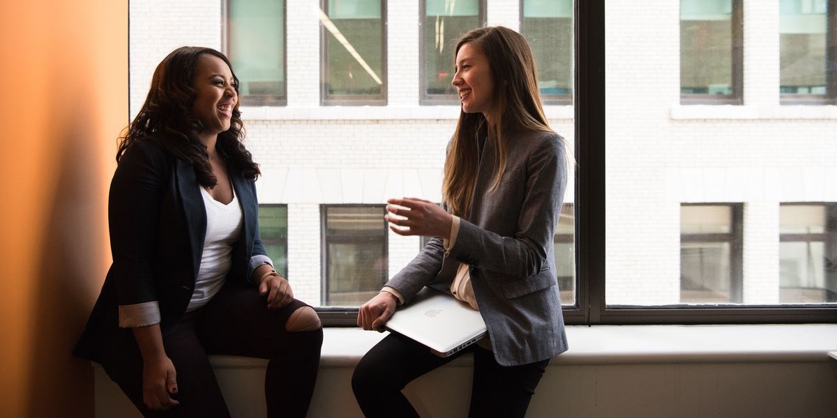 Two women talking during an interview