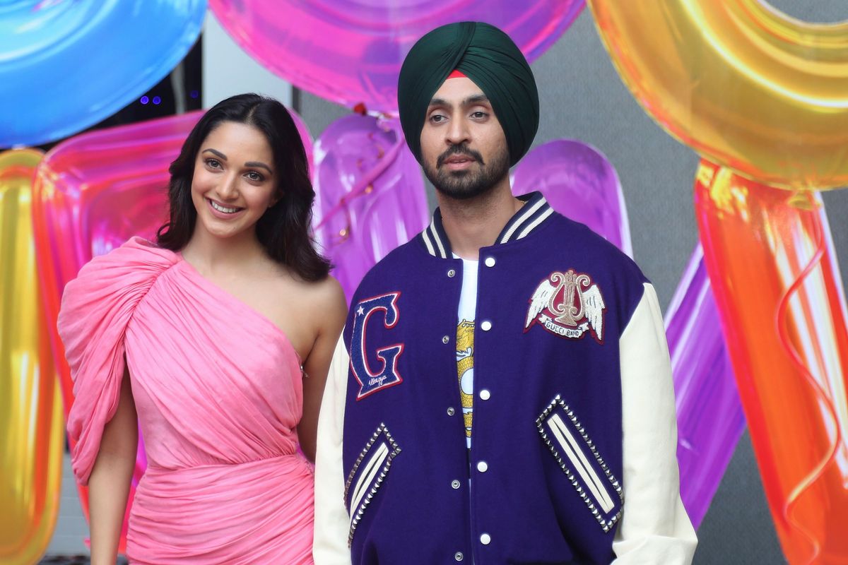 Bollywood actors Kiara Advani, left, and Diljit Dosanjh pose for photographs during the trailer launch of their upcoming film Good Newwz in Mumbai