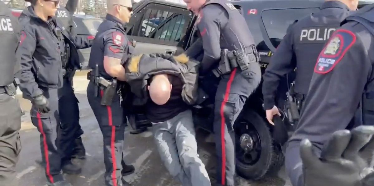 NextImg:10 cops arrest pastor as he protests drag queen reading for kids; he spends Easter in jail — his latest stint behind bars for standing up to such events in Canada