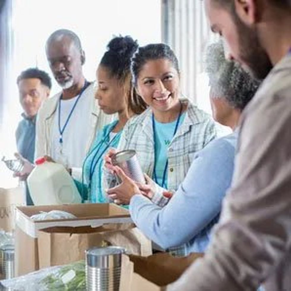 Volunteers filling boxes with food donations