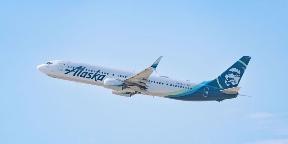 NextImg:Intoxicated passenger allegedly lights up a cigarette, drinks hand sanitizer, assaults woman on flight to Alaska: 'We're all going to die'