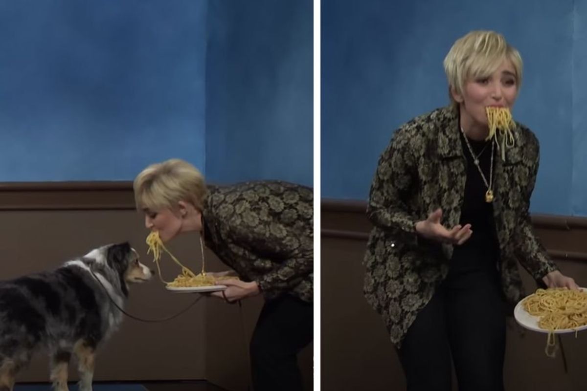 blonde woman eats spaghetti with a dog