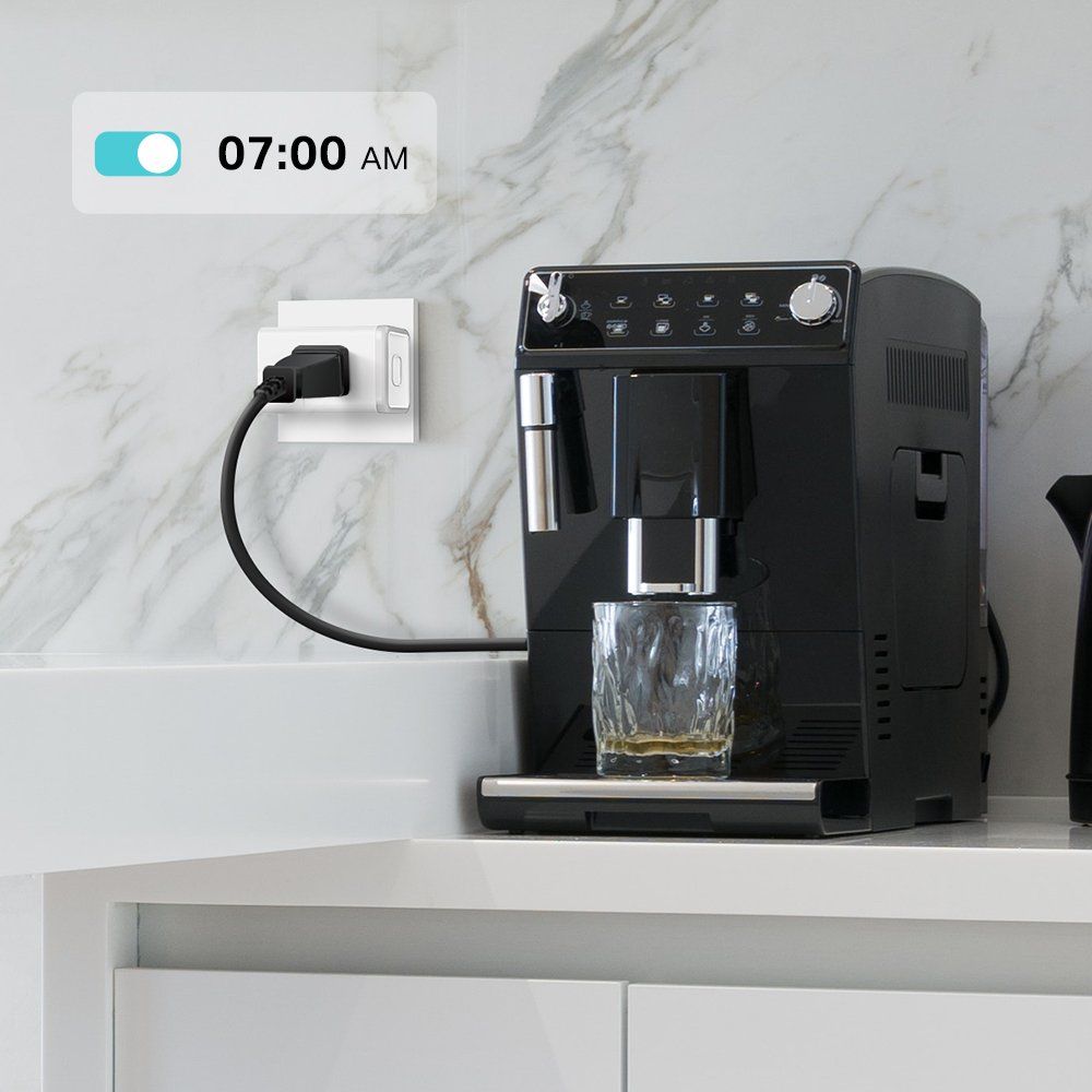 a photo of a coffice machine plugged into a smart plug