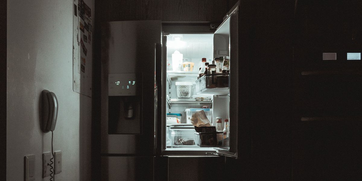 Refrigerator door left open at nighttime