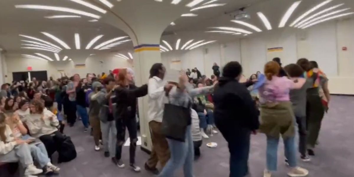 NextImg:Crazed leftists desecrate Bible, form conga line, sing Miley Cyrus song to disrupt free speech event