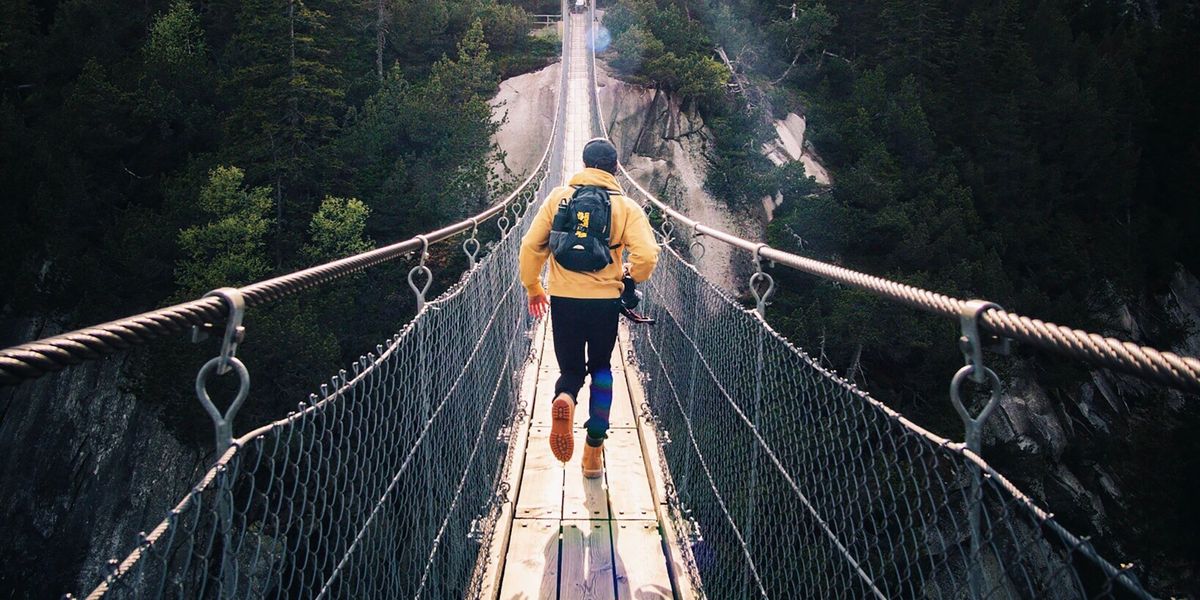 Hiker on rope bridge