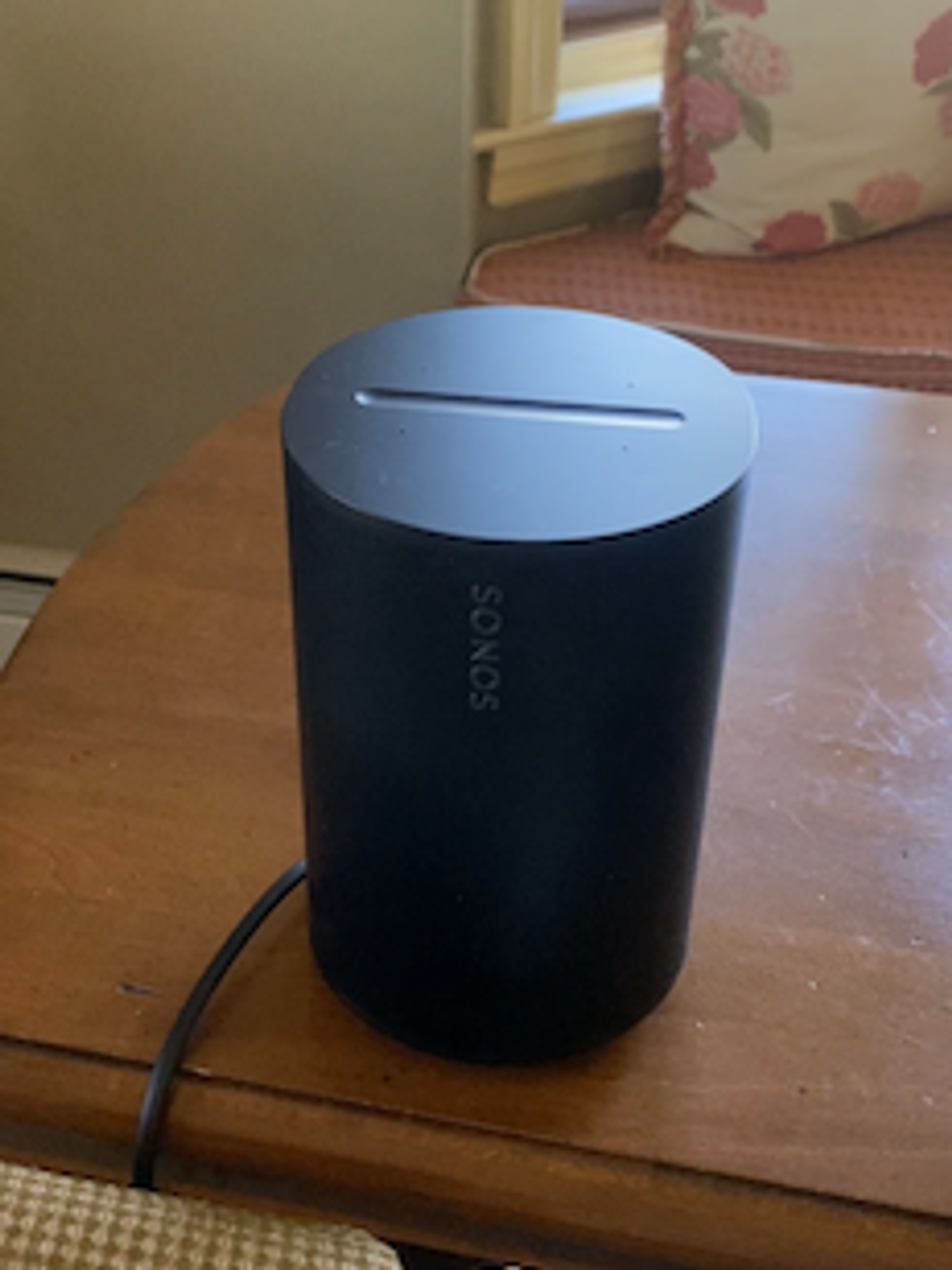 a photo of Sonos Era 100 Smart Speaker on a table