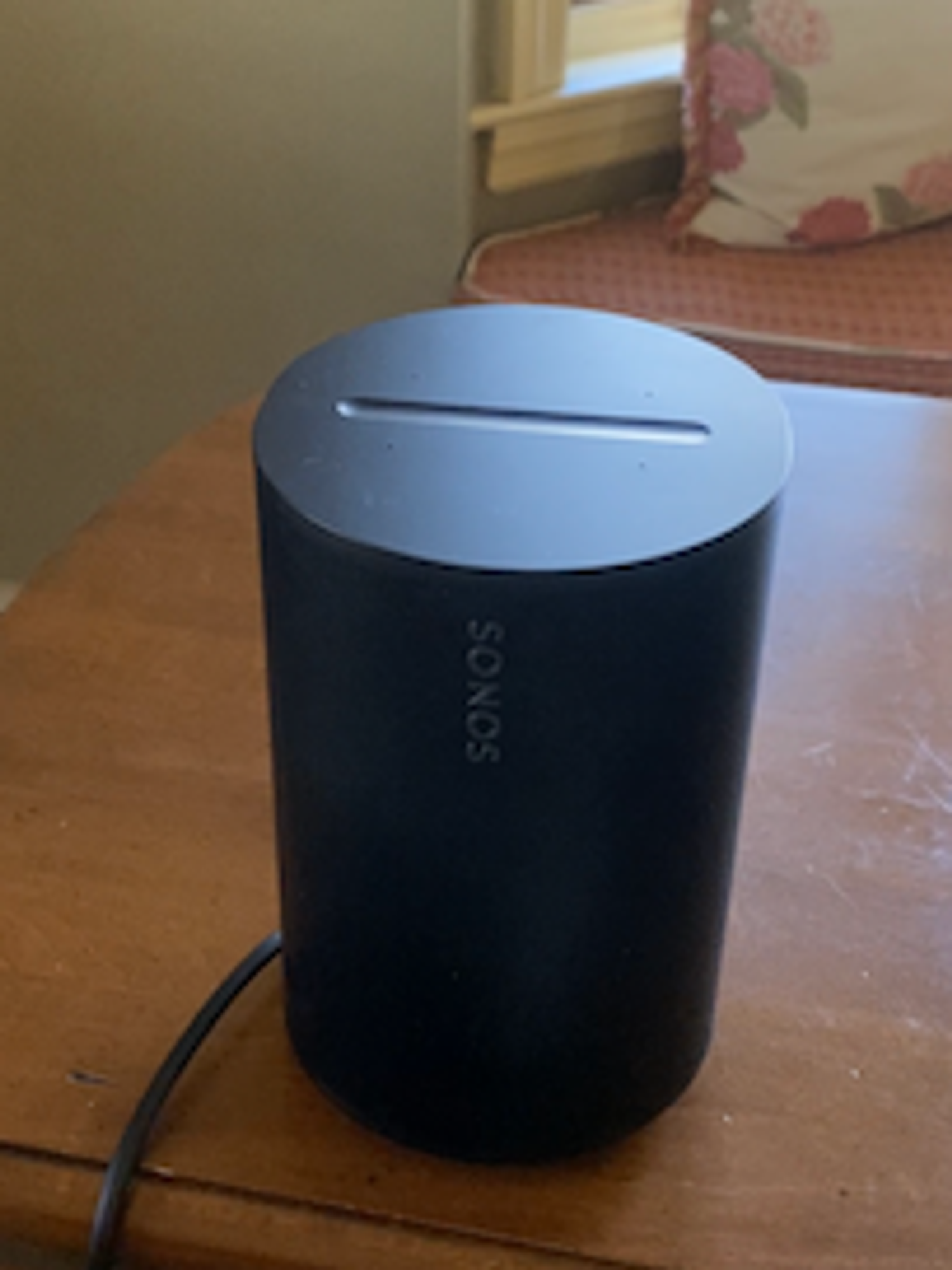 a photo of Sonos Era 100 Smart Speaker on a table