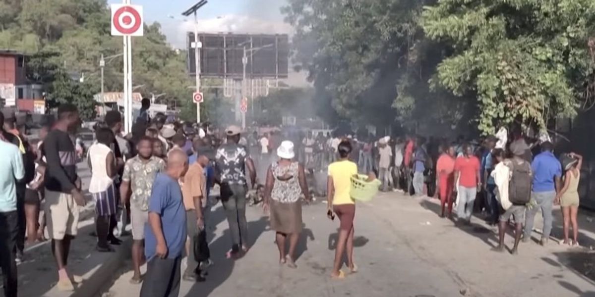 NextImg:Vigilante mob burns 13 gang members to death with gas-soaked tires in the streets of Haiti's capital