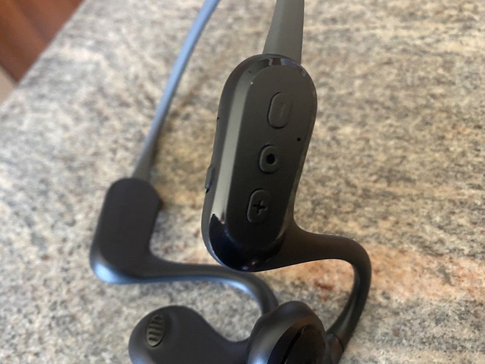 a photo of the controls on the side of RunFree Lite headphones