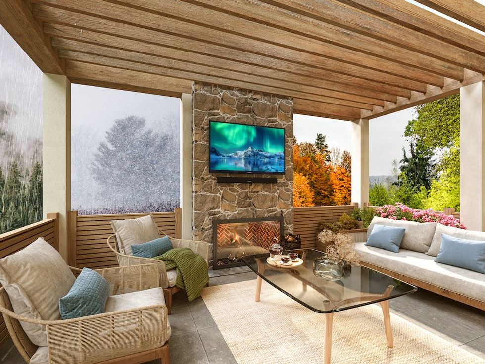 a photo of a full shade Furrion smart tv on a wall on a porch