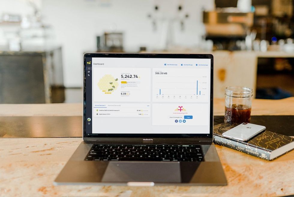 a photo of a laptop with honeygain app