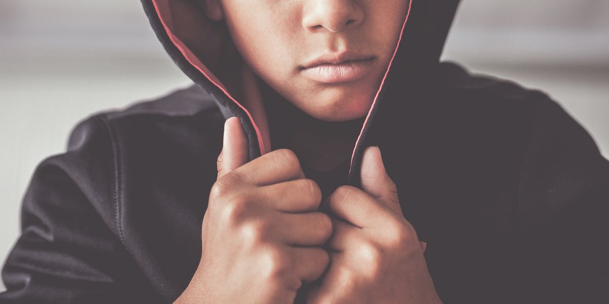 Angry kid wearing a hoodie