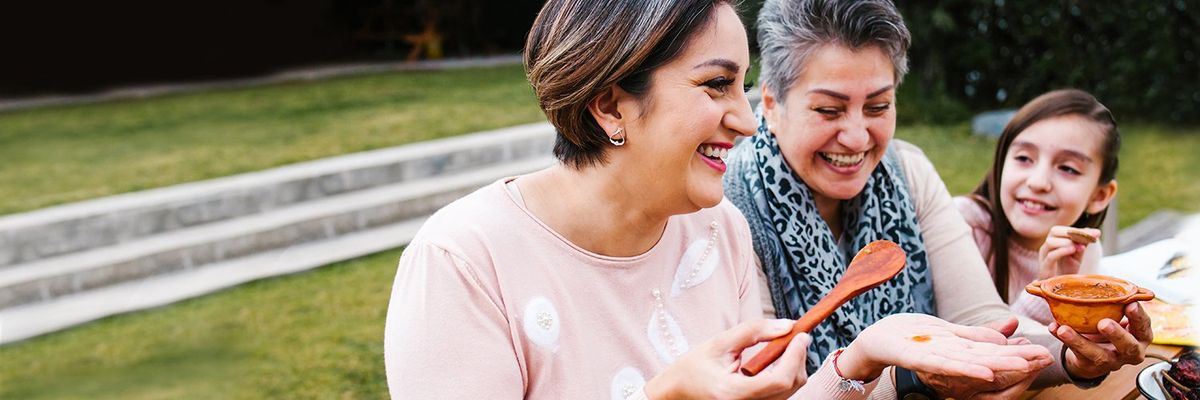three generations of women laughing together