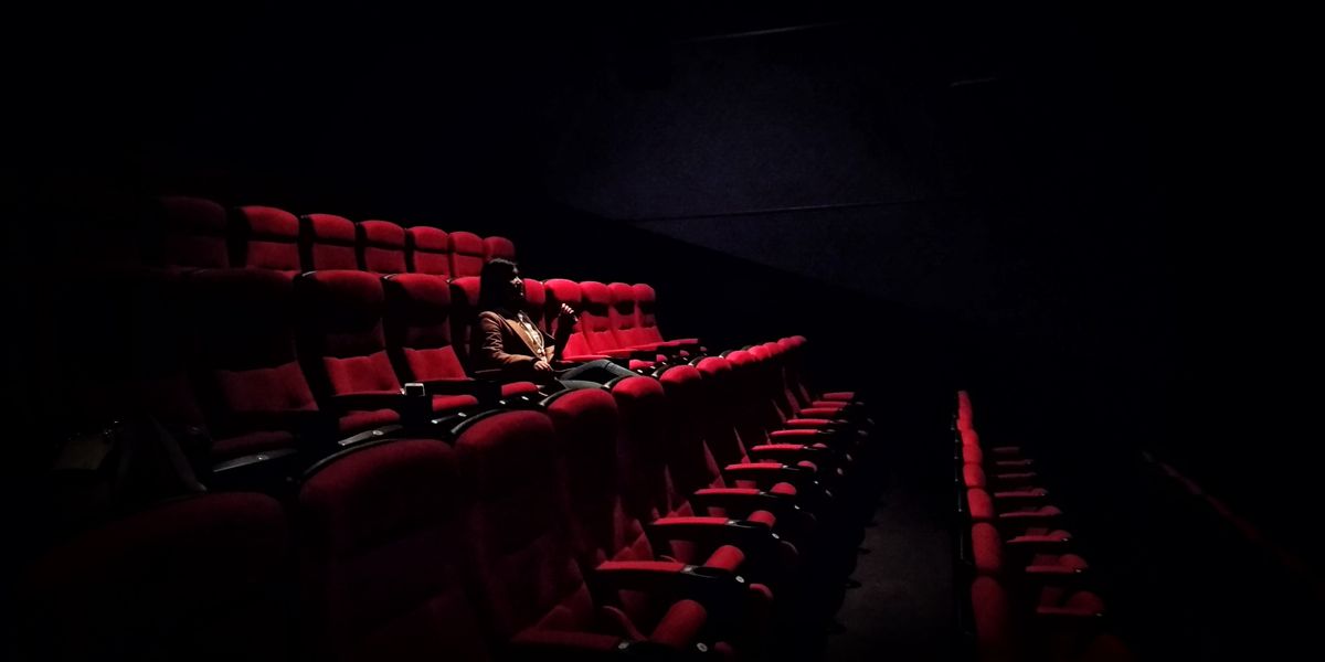 Lone moviegoer in a theater