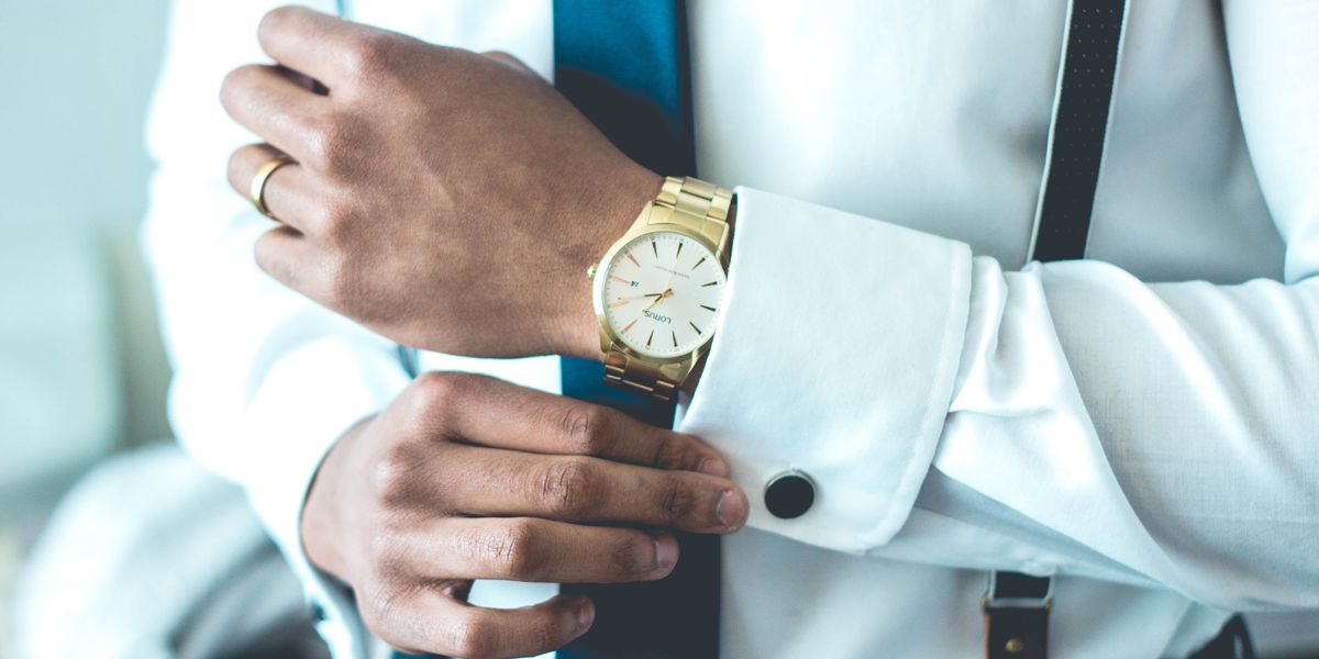 Man wearing gold watch