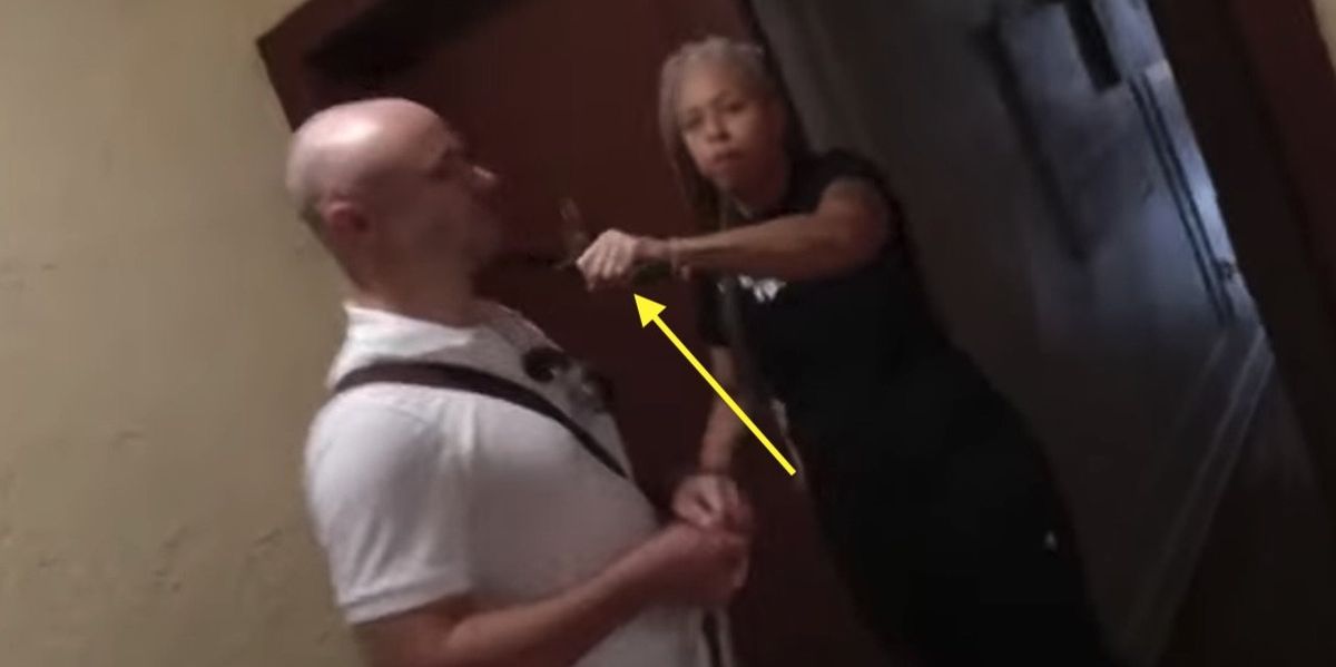 Machete-wielding professor who threatened to 'chop' up reporter is arrested — but she claims to be the real victim