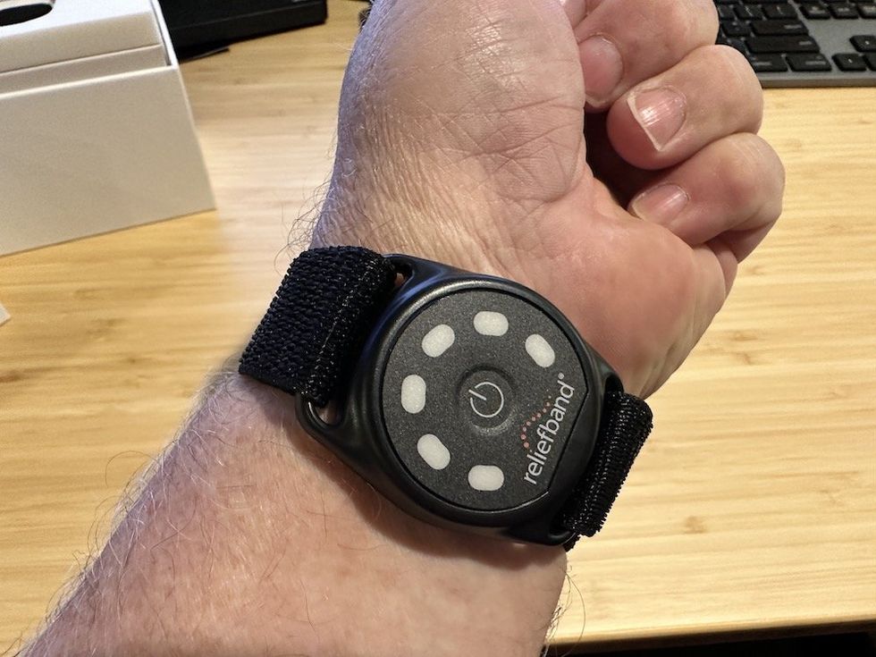a photo of Reliefband on a man's wrist