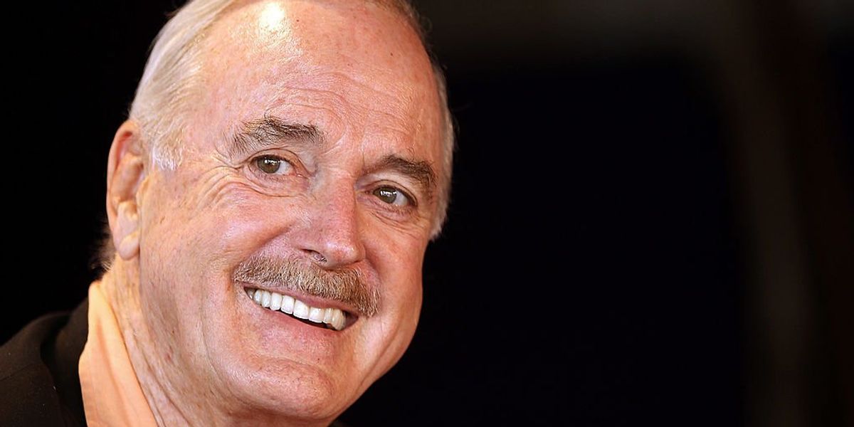 NextImg:John Cleese refuses to remove 'Life of Brian' joke about a man becoming a woman and having a baby that critics call 'transphobic'