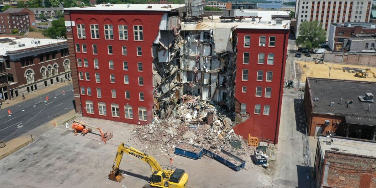 NextImg:Officials claimed no one left in partially collapsed apartment building, and it was set for demolition. But loved ones pressured officials, who now confirm 5 unaccounted for, 2 likely trapped.