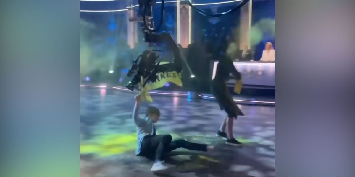 NextImg:Video: Cameraman takes out climate activist who stormed on stage to disrupt live TV broadcast