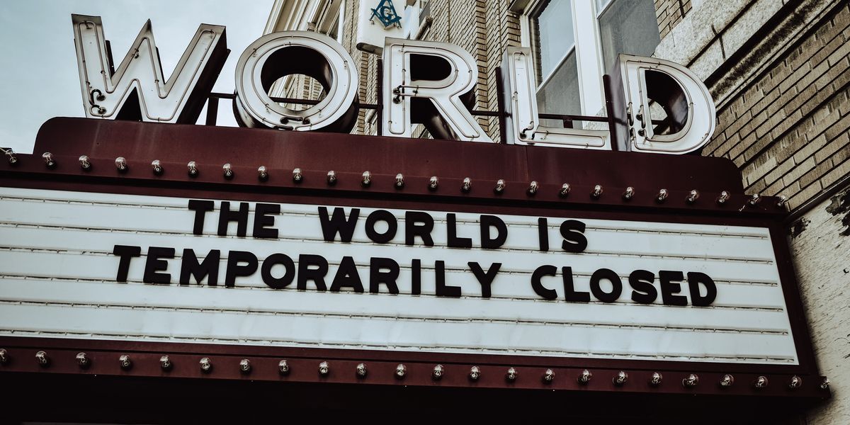 The World Theatre's placard, which reads, "The World is Temporarily Closed"