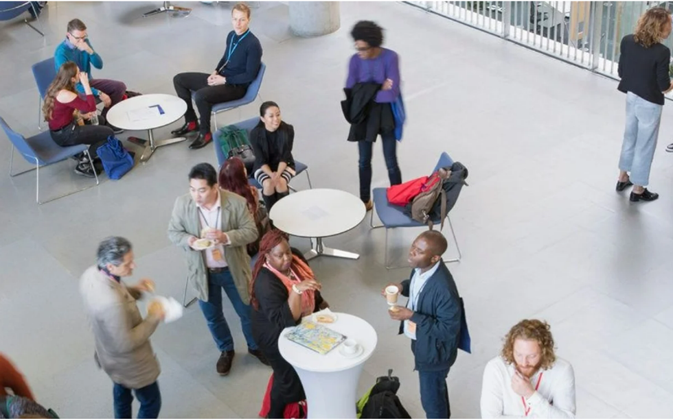 People huddled in groups for networking