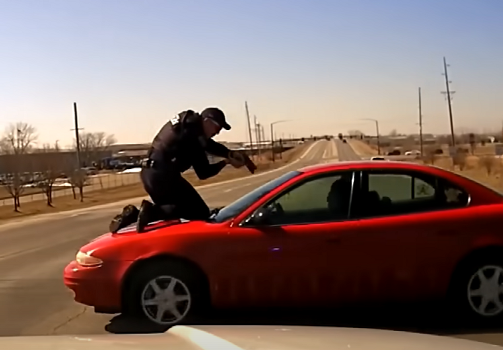 Nerve-racking bodycam video shows cop clinging to runaway car during wild police chase Nerve-racking bodycam video shows cop clinging to runaway car during wild police chase