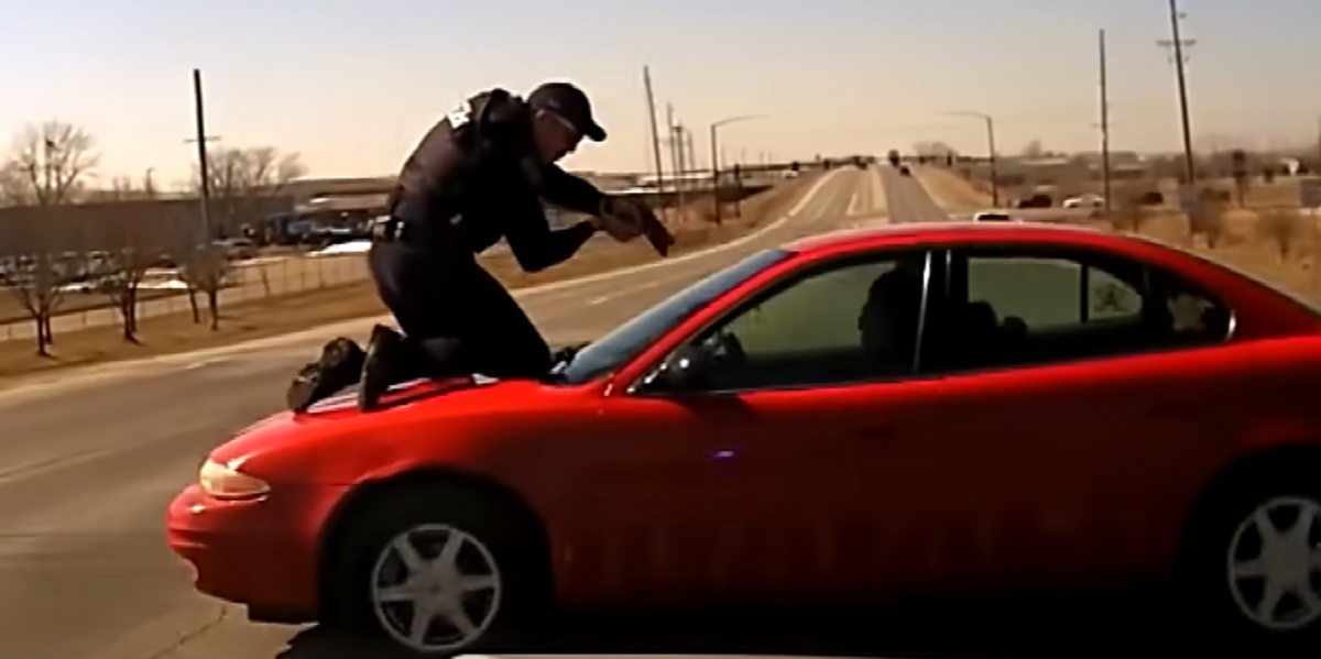 NextImg:Nerve-racking bodycam video shows cop clinging to runaway car during wild police chase