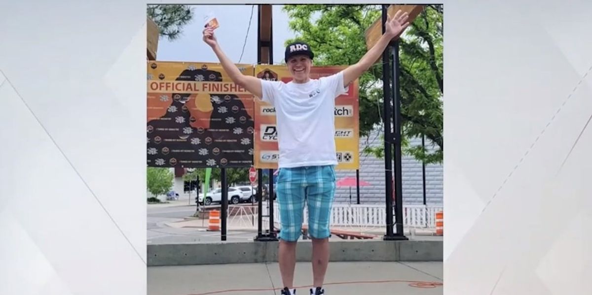 NextImg:Man who won women's cycling race stands alone on podium after female competitors refuse to join him