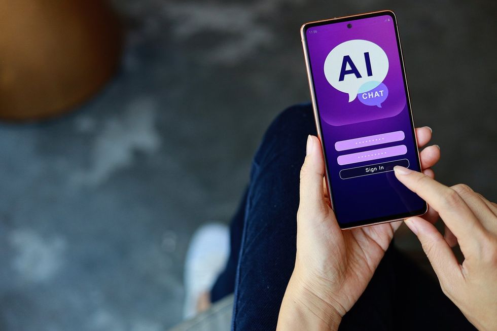 a smartphone with an AI chat bot showing