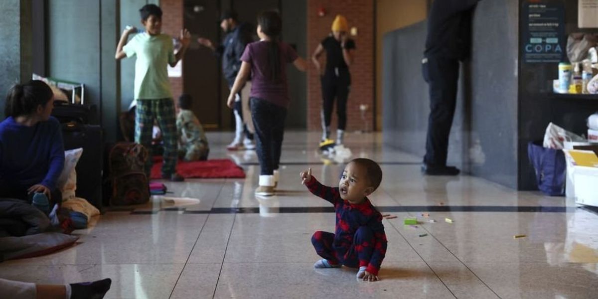 NextImg:Chicago overwhelmed with migrant influx; families sleeping in police stations