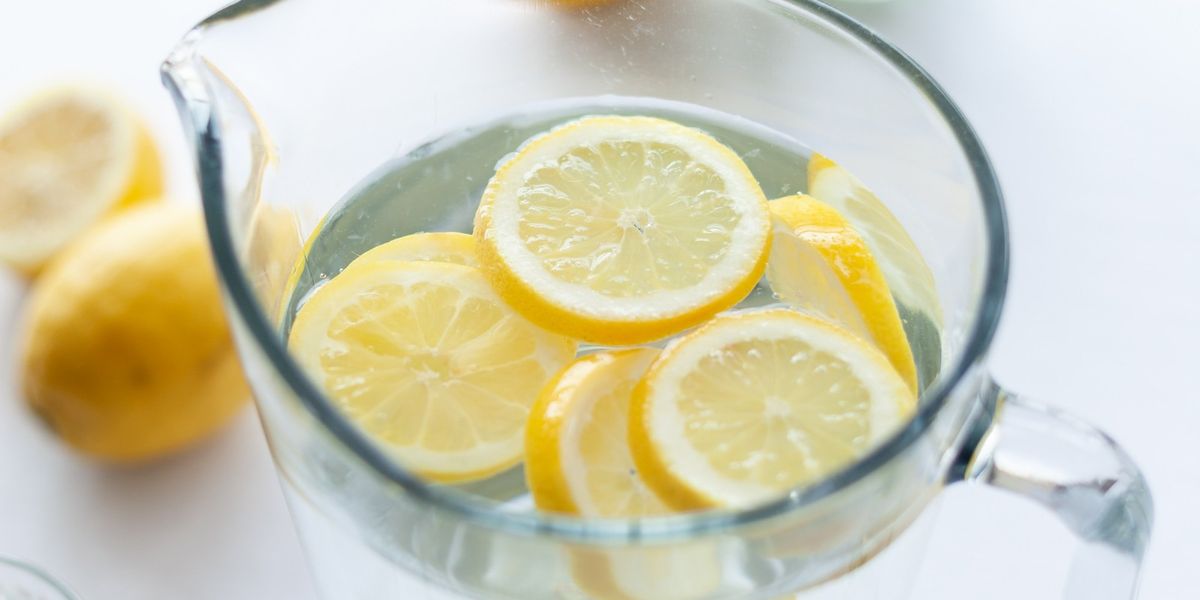 slices of lemons in clear pitcher filled with water