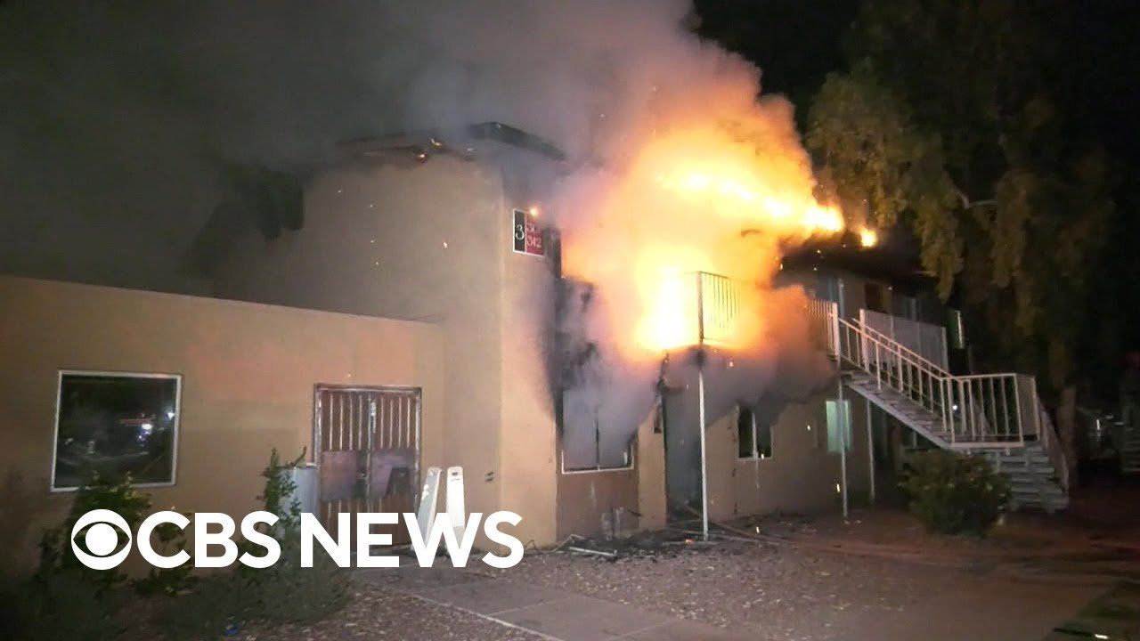 Man catches entire family as they jump from burning building