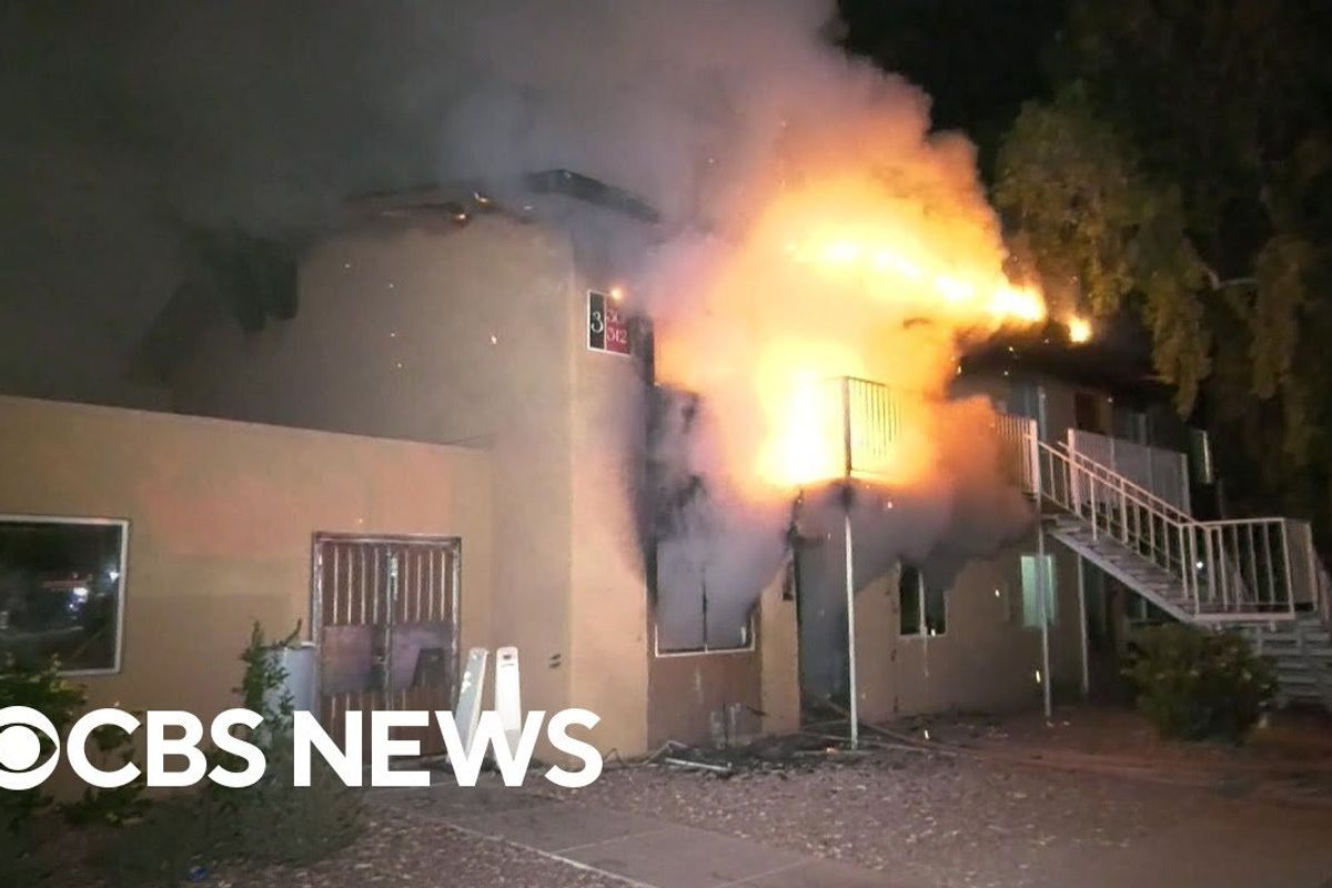 screenshot from CBS News of burning building