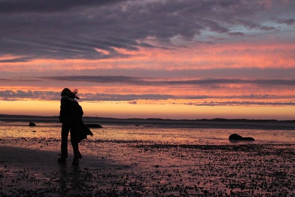 girl on beach at sunset