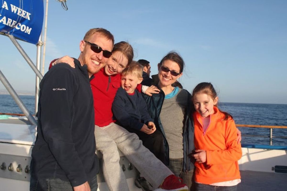 family of five on a boat