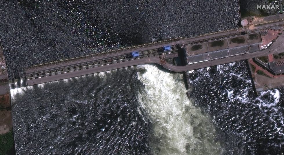 Villages Evacuate After Ukraine Dam 'Partially Destroyed' By Russia