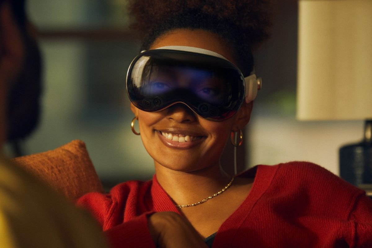 a woman wearing Apple Pro Vision Mixed Reality Headset